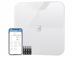 white smart scale next to phone